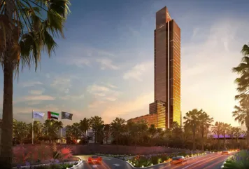 Luxury high-rise tower in the UAE with palm-lined road and national flags, ideal for commercial space for rent.