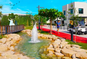 Modern family-friendly community in Sharjah, UAE with villas, jogging track, water feature, and landscaped gardens